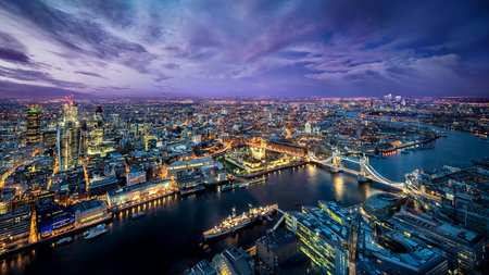 London cityscape at night with Thames river and Tower Bridge, UKの写真素材