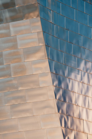 Detail of the facade of a modern office building reflecting the sunlightの写真素材