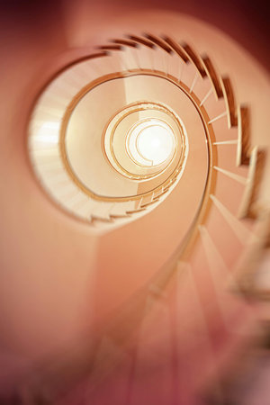 Spiral stairs in a modern building. Abstract architectural background.の写真素材