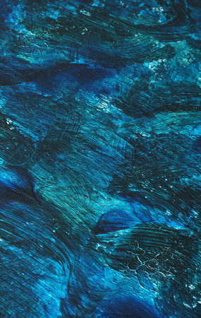abstract background of blue oil paint on canvas, close-up