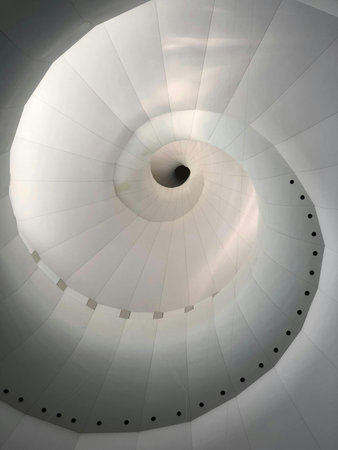Spiral staircase in a modern building, closeup of photoの写真素材