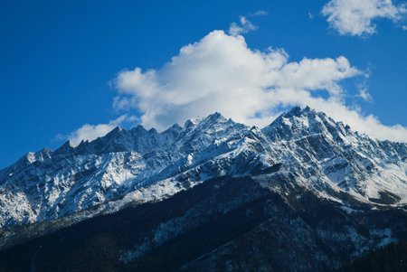 Mountain landscape with snow and blue sky. Caucasus Mountains, Georgia, region Gudauri.