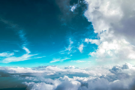 Blue sky with white clouds. View from airplane window. Nature backgroundの写真素材