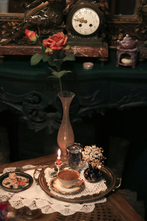 Vintage table setting with roses, candles and candlesticks.の写真素材