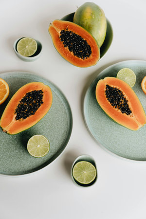 Papaya and lime on white background. Flat lay, top viewの写真素材