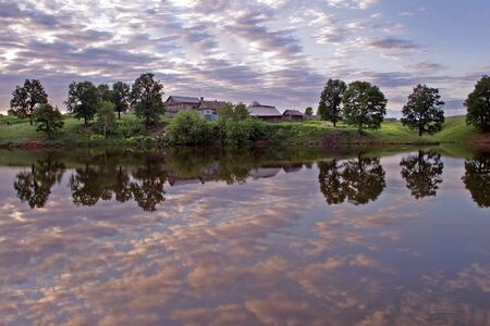 walk along the pond in the villageの写真素材