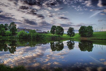 walk along the pond in the villageの写真素材