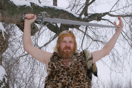 portrait of a man with a beard and mustache, sword in hand, waist