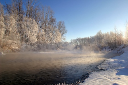 scenic winter landscape river and trees consecrated rising sun