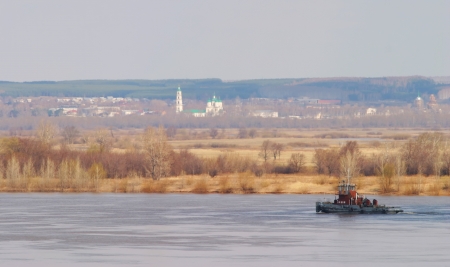 Spring view of the valley and the river with a settlementの写真素材