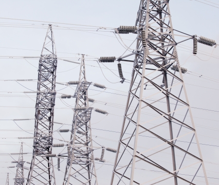 An unusual view of the high voltage on a snowy meadow