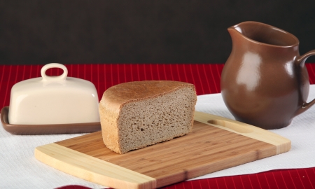 close-up of sliced bread on a cutting board and other edibles studio