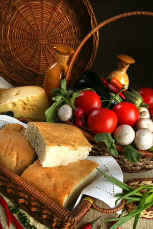 macro bread and vegetables in wicker basketsの写真素材