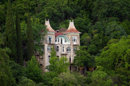 summer landscape beautiful old stone house in the mountains of Abkhazia verdantのeditorial素材