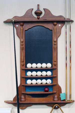 Close-up wooden stand for billiard balls and cue