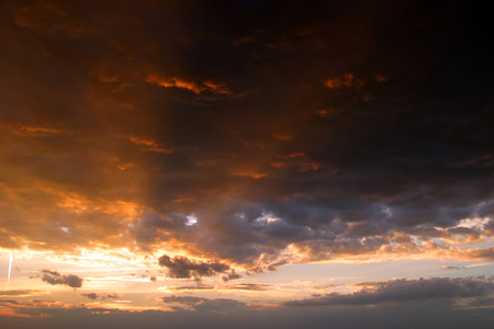 beautiful clouds colored glow of the setting sun on the sky background