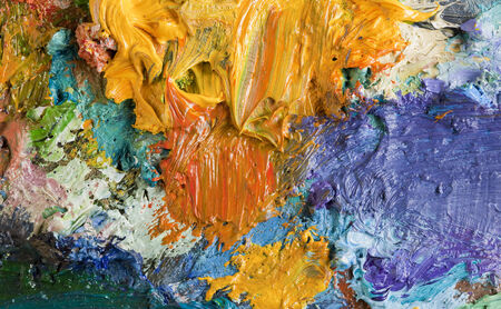 macro texture of colorful oil paints on an artist's palette