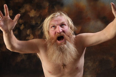 close-up portrait of a naked man with a beard and mustache, expressing strong emotions, the studio...