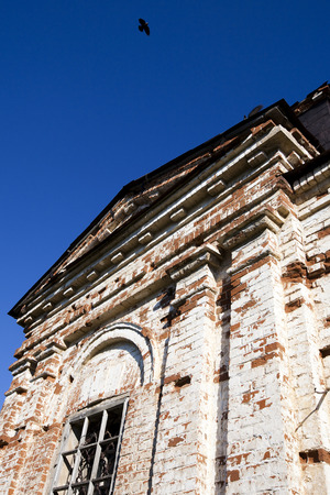 exterior of an old ruined temple of bricks on a sunny spring dayの写真素材