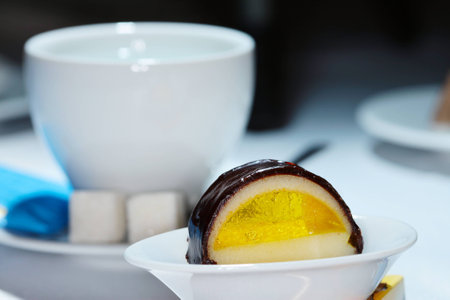 macro beautiful and tasty dessert on a white plate in a restaurantの写真素材