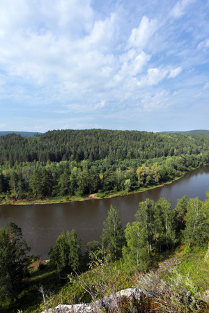 Summer mountain landscape Idrissova Cave in the Urals, the river and the forest on a sunny day the view from the hillの写真素材