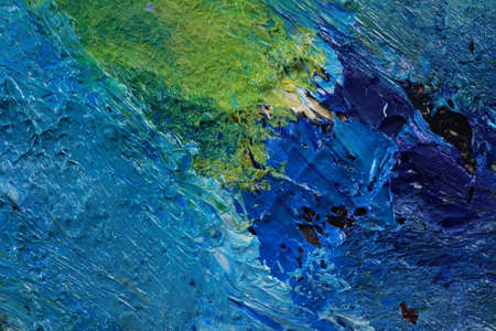macro artist's palette, texture mixed oil paints in different colors and saturation studioの写真素材