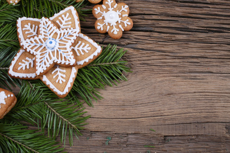 close-up still-life of fir branches and the gingerbread with pattern on magic Christmas holiday on...