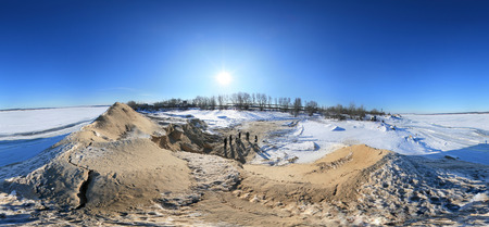 360 panorama, winter landscape trees in frost and snow drifts on the river on a bright sunny dayの写真素材