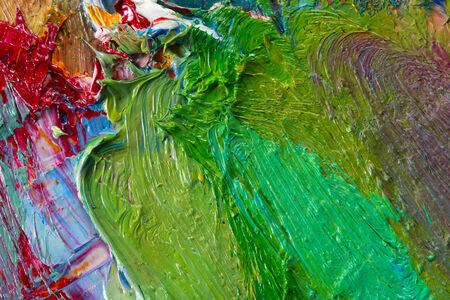 macro artist's palette, texture mixed oil paints in different colors and saturation studioの写真素材