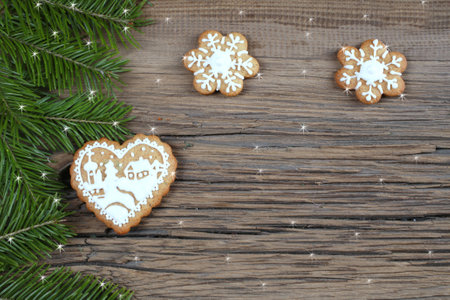 close-up still-life of fir branches and the gingerbread with pattern on  magic Christmas holiday on...