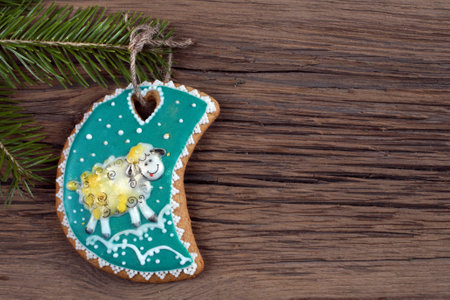 close-up still-life of fir branches and the gingerbread with pattern on magic Christmas holiday on...