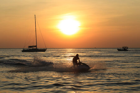 Pattaya, Thailand - December 21: marine leisure on the beach at sunset December 21, 2014 in Pattaya, Thailand.のeditorial素材