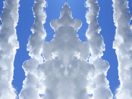 close-up of white smoke against a blue sky on a sunny dayの写真素材