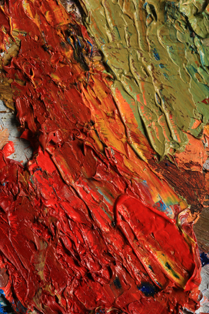 macro artist's palette, texture mixed oil paints in different colors and saturation studioの写真素材