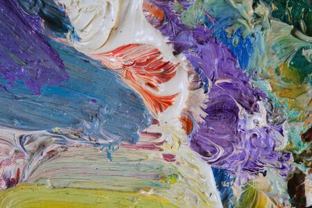 macro artist's palette, texture mixed oil paints in different colors and saturation studio