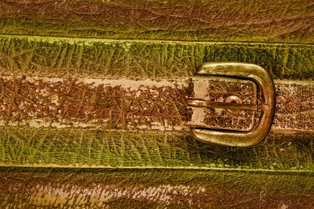 close-up fragment of locks and fasteners on the vintage leather suitcase brown の写真素材