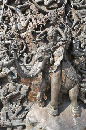 close-up fragment of stucco wall of a Buddhist templeの写真素材