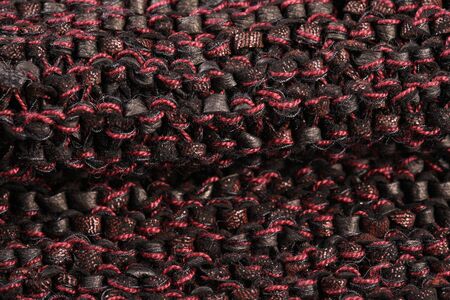macro texture of burgundy knitted fabric studio
