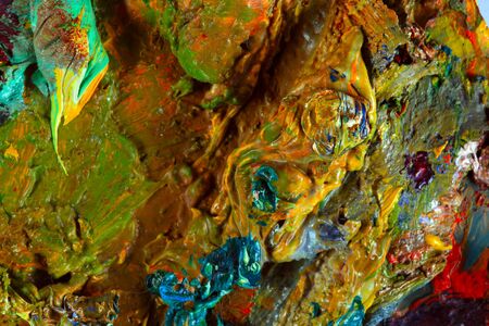 macro artist's palette, texture mixed oil paints in different colors and saturation studio