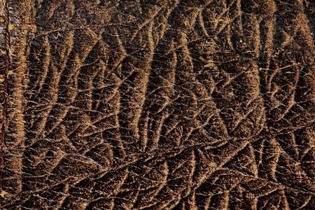 macro texture fragment of the old worn brown leatherの写真素材