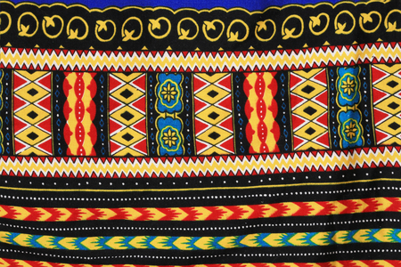 macro texture fragment of cloth with a pattern in the style of embroideryの写真素材