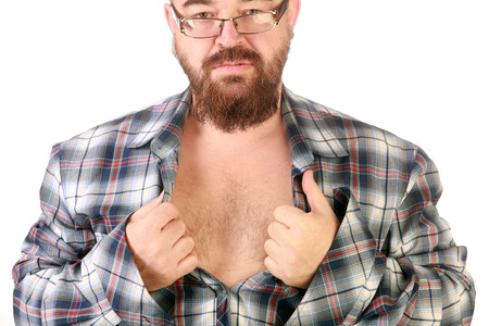 Close-up portrait of a young man with a beard and mustache, tearing his shirt on his chest
