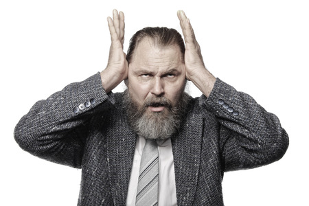 close-up portrait of a charismatic man with a beard and mustache in suit Studioの写真素材