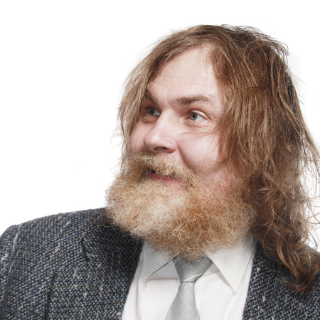 close-up portrait of a charismatic man with a beard and mustache in suit Studio