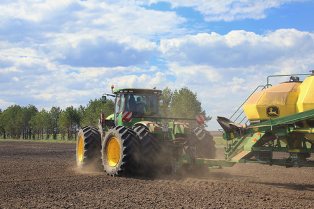 Naberezhnye Chelny, Russia - May 12, 2015: Planting in the field with the help of modern technology on a sunny spring day in May 2015のeditorial素材