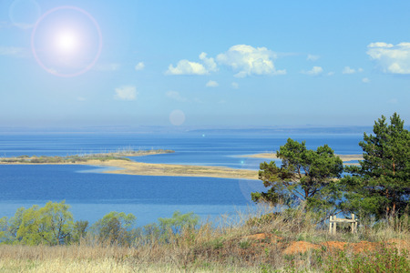 spring landscape wide and calm river in the early morning, view from the hillの写真素材