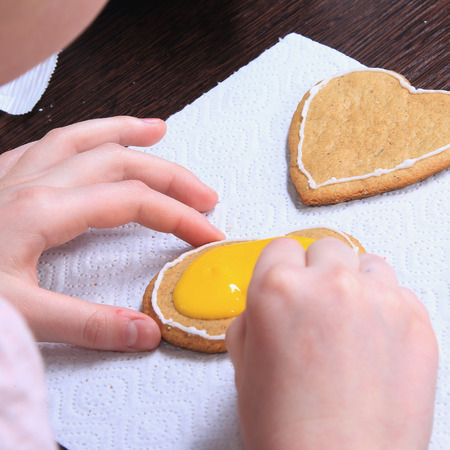 close-up of the process of hand-painted ginger cookies