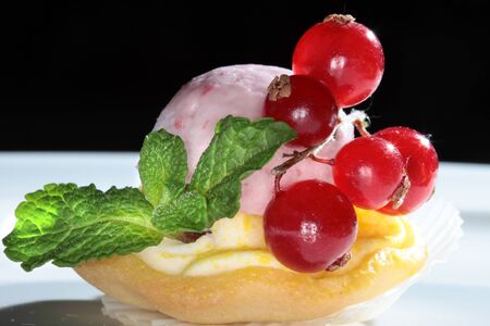 close-up delicious cake with red currant on a dark background Studioの写真素材