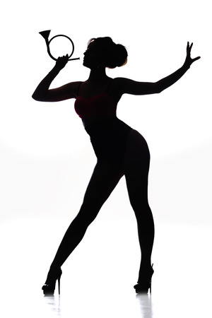 Full length portrait of a beautiful slim girl on a light background studioの写真素材