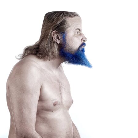 close-up portrait of an adult male with long hair, blue beard and torso on white background studioの写真素材